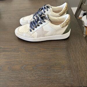 Vintage Havanas white sneakers with gold glitter, navy strings and army green.